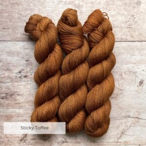 Three skeins of Mohair Sock in shades of amber, gold and toffee