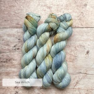 Three skeins of Mohair Sock in pale blue green with splashes of yellow