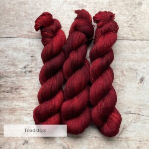 Three skeins of Mohair Sock in a deep, dark blood red