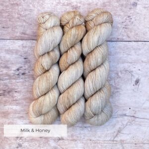 Three skeins Mohair Sock in shades of cream and buff