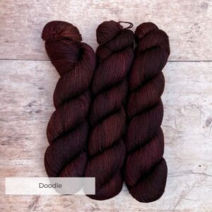 three skeins of Mohair sock wool in brown, dusty pink and bronze