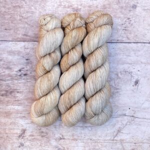 Three skeins Mohair Sock in shades of cream and buff