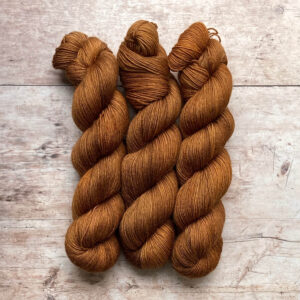 Three skeins of Mohair Sock in shades of amber, gold and toffee