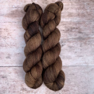 Two skeins of Merino Floofin a rich deep brown