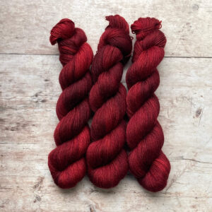Three skeins of Mohair Sock in a deep, dark blood red