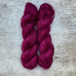 Two skeins of deep bright pink mohair