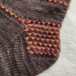 A close up of a sock heel