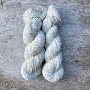 two skeins of undyed crazy white wool