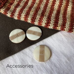 Shell buttons scattered on a cloth