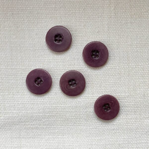5 four hole dusty plum corozo buttons with flat rim