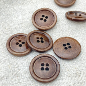 Brown bone buttons on a cloth background