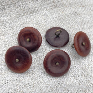 Five brown buttons with a bronze metal shank