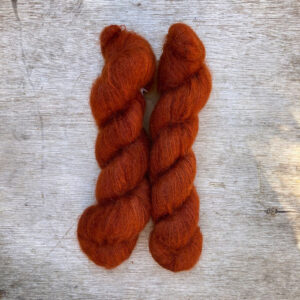 Two skeins of burnt orange mohair and silk lace