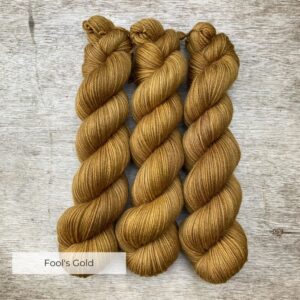Three skeins of of golden mustard Classic sock