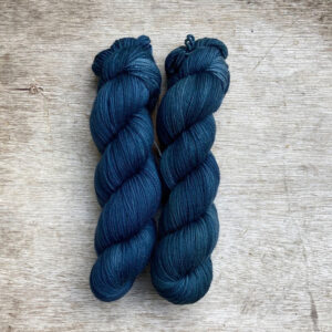 Two skeins of plump DK in dark, moody blue