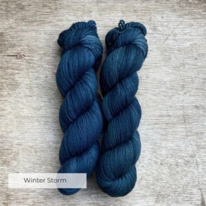 Two skeins of plump DK in dark, moody blue