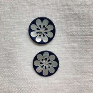 Two, matt navy shell buttons with a laser flower design, 20mm