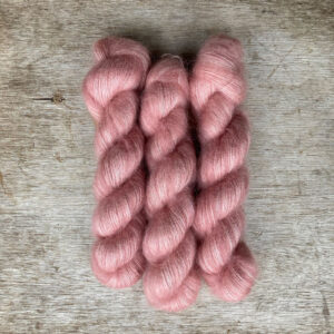Three skeins of mohair lace in palest pink