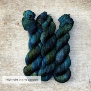 Three skeins of Mohair Sock wool in dark blues, emeralds and lime