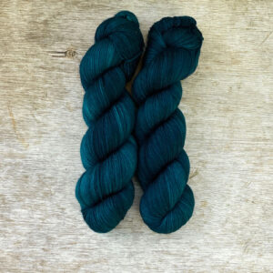 Two skeins of deep teal DK wool