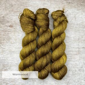 Three skeins of soft silky wool in an acid yellow green