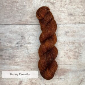 skeins of merino and linen in a rich rust