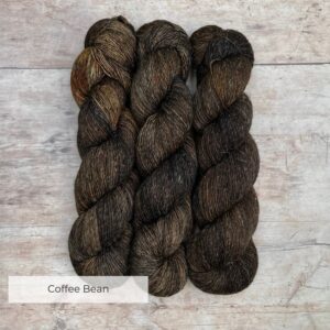 Three skeins of merino and linen in a in dark brown and grey