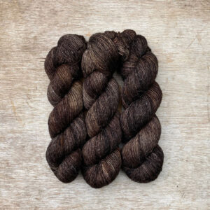 Three skeins of merino and linen in a in dark brown and grey