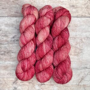 Variegated Flax yarn in mid to deep pink
