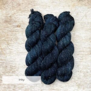 Three skeins of merino and linen in darkest blue black
