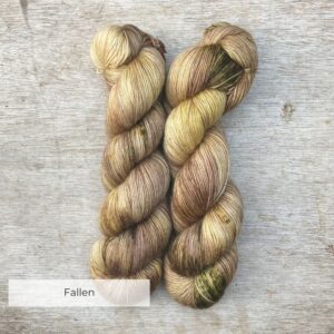 Two skeins of Merino Floof in cream, coffee and moss green