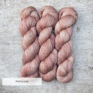 Three skeins of Merino & Silk in palest shell pink