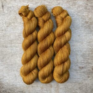 Three skeins of Mohair Sock in a rich golden yellow
