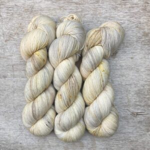 Three skeins of Classic Sock in cream and cafe au lait