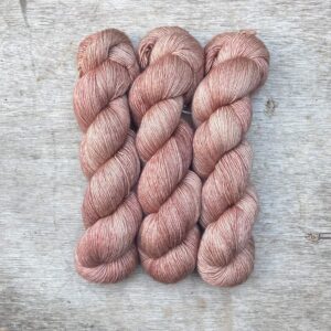 Three skeins of Merino & Silk in palest shell pink