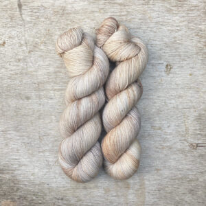 Three skeins of Classic Sock in buttercream, coffee and gold