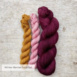 Classic sock set in Plush red for the min skein and a mini of deep gold and pale pink