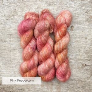 Three skeins of pink, yellow and gold mohair and silk lace