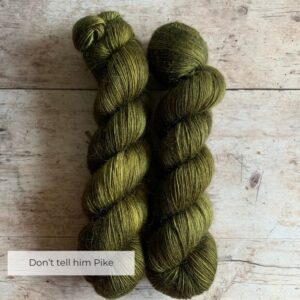 Two skeins of Floof in a dark Khaki