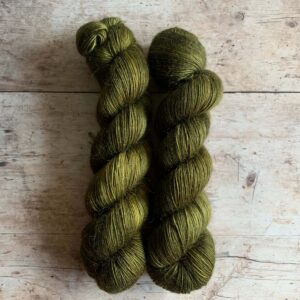 Two skeins of Floof in a dark Khaki