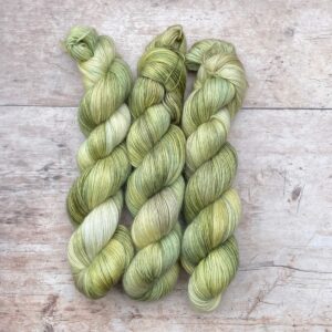 Three skeins of Merino Floof in shades of green and moss