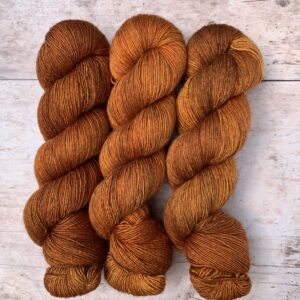 Deep rusty orange silky yarn semi solid yarn