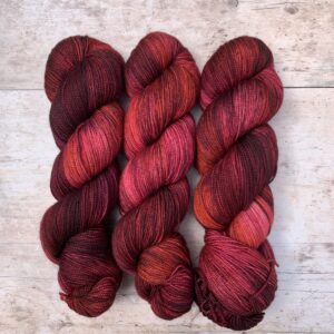 Deep red and pink variegated Classic Sock yarn