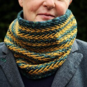 A woman wearing a herringbone knitted cowl