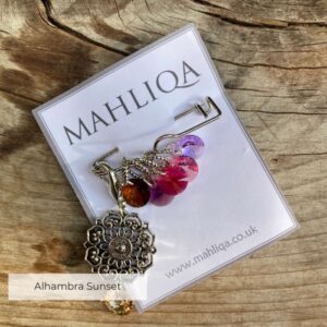 A removable marker with five crystal markers in lilacs, plums and pinks