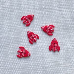 Five scarlet red rocket shaped buttons
