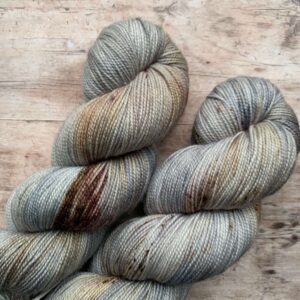 2 skeins Classic Sock in blue grey with maroon, brown and rust speckles