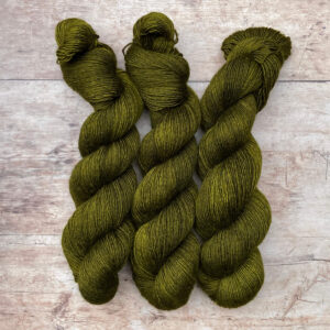 Three skeins of merino and silk in a deep, rich olive green
