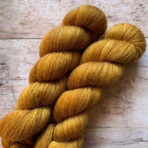 Two skeins of fluffy Merino Mohair in a yellow gold colour