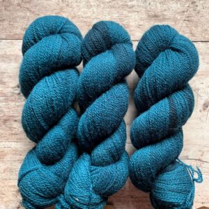 Two skeins of deep teal 4ply wool